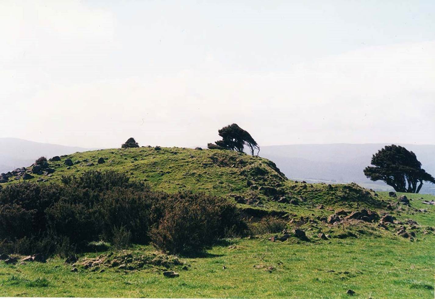 A picture containing outdoor, grass, sky, hill  Description automatically generated